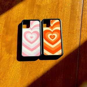 2 Wildflower “Latte Love” phone cases in pink and orange. Will fit an iPhone 11